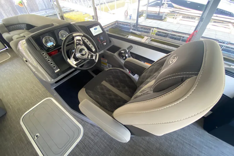 Slide: The Image of 2023 Barletta Lusso 25UCA helm with luxurious seating and modern dashboard controls. - 22