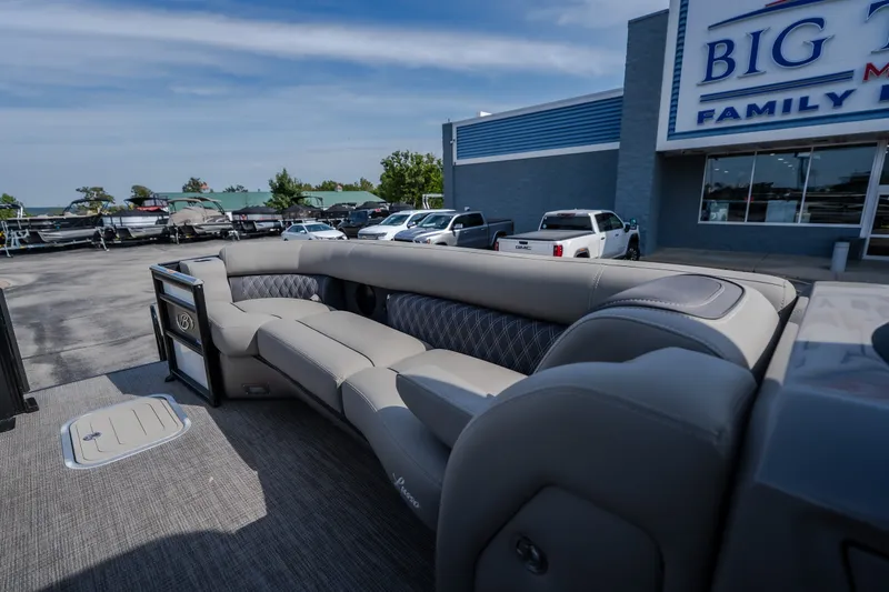 Slide: The Image of 2023 Barletta Lusso 25UCA pontoon boat with luxurious seating at a dealership. - 35