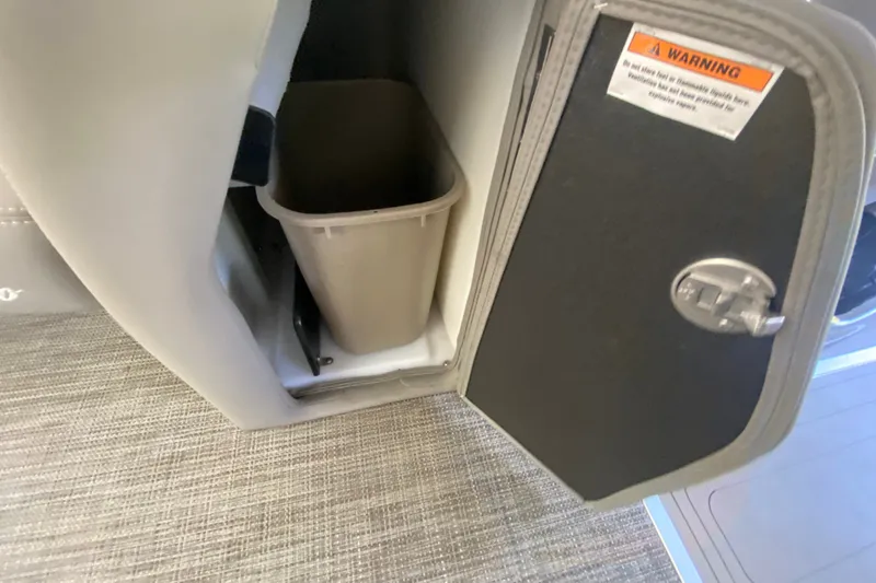 Slide: The Image of Open storage compartment with trash bin in 2023 Barletta Lusso 25UCA boat. - 34