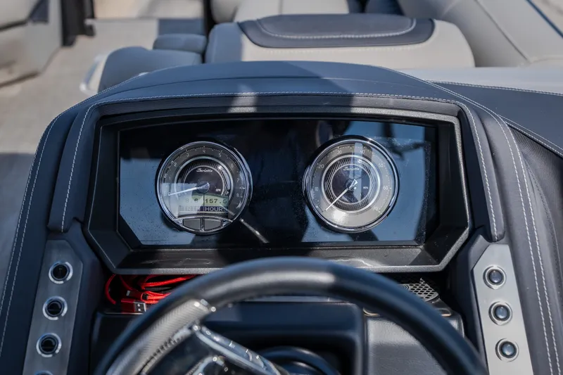 Slide: The Image of Dashboard of 2023 Barletta Lusso 25UCA pontoon boat with gauges and steering wheel. - 33