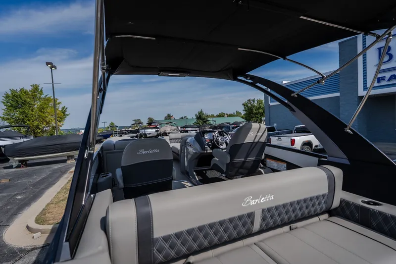 Slide: The Image of 2023 Barletta Lusso 25UCA pontoon boat interior with luxurious seating and modern design. - 20