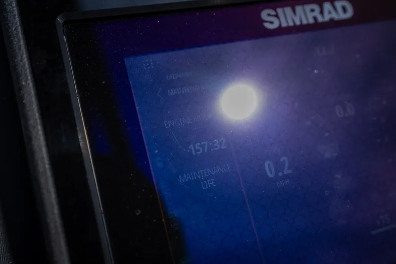 Slide: The Image of Simrad display on 2023 Barletta Lusso 25UCA showing engine hours and maintenance life. - 49