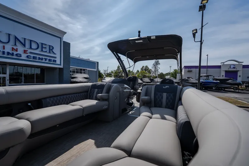 Slide: The Image of 2023 Barletta Lusso 25UCA pontoon boat interior at a marine dealership. - 45