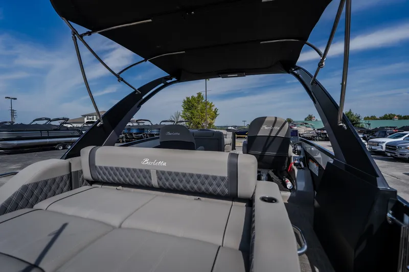 Slide: The Image of 2023 Barletta Lusso 25UCA pontoon boat with luxurious seating and sleek design. - 19