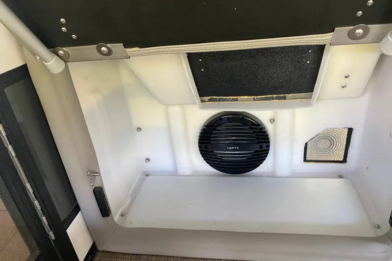 Slide: The Image of 2023 Barletta Lusso 25UCA interior with speaker and storage compartment. - 35