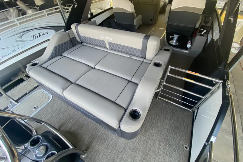 Slide: The Image of 2023 Barletta Lusso 25UCA pontoon boat interior with luxurious seating and cup holders. - 18
