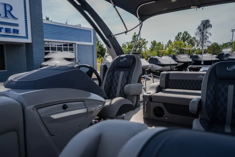 Slide: The Image of 2023 Barletta Lusso 25UCA boat interior with luxurious seating and modern dashboard. - 41