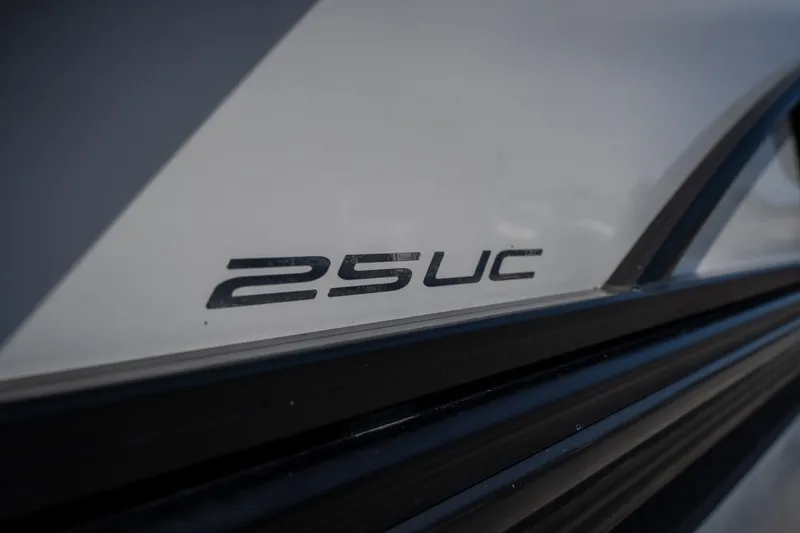 Slide: The Image of Close-up of 2023 Barletta Lusso 25UCA model emblem on boat exterior. - 13