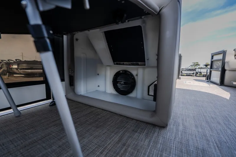 Slide: The Image of 2023 Barletta Lusso 25UCA interior storage compartment with speaker, showcasing luxury design. - 30