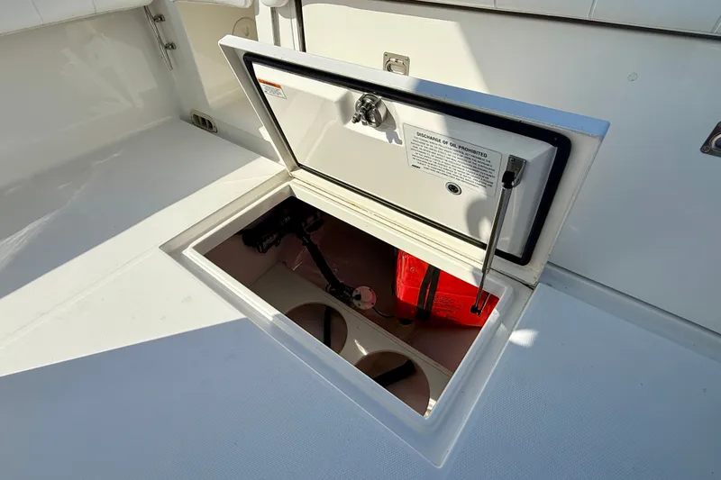 Slide: The Image of Open storage compartment on 2014 Regulator 28 Forward Seating boat. - 38