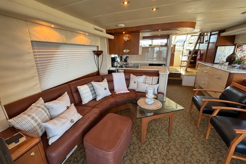 Slide: The Image of Luxurious 1996 Queenship yacht interior with leather seating, modern decor, and elegant furnishings. - 24