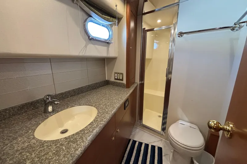 Slide: The Image of Bathroom interior of a 1996 Queenship yacht with sink, shower, and toilet. - 2