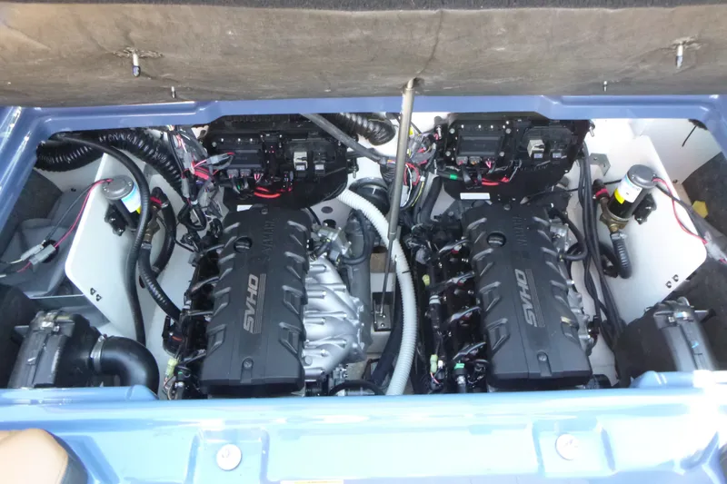 Slide: The Image of 2024 Yamaha Boats 255XD engine compartment with dual engines and wiring. - 17