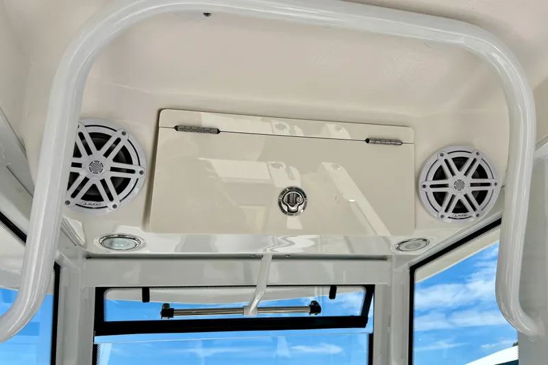 Slide: The Image of 2027 Robalo R250 Center Console boat interior with speakers and storage compartment. - 19