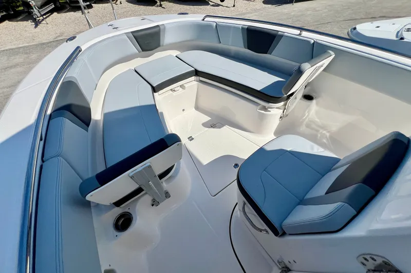 Slide: The Image of 2027 Robalo R250 Center Console boat interior with cushioned seating and sleek design. - 20