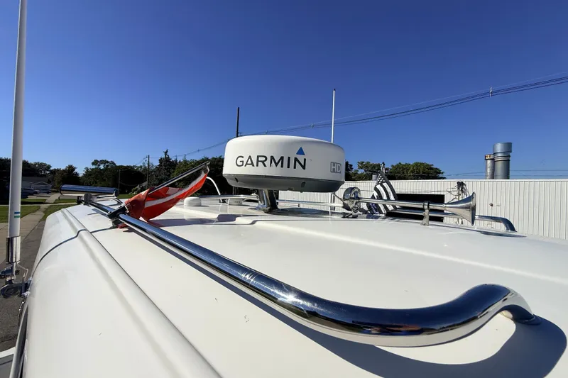 Slide: The Image of 2011 Protector Tauranga 38 boat with Garmin radar and flag on deck. - 17