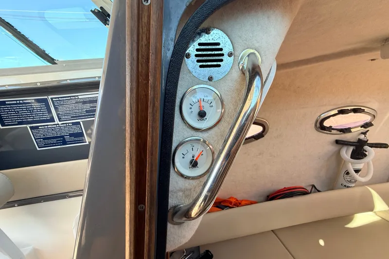 Slide: The Image of Interior of 2011 Protector Tauranga 38 boat showing gauges and seating area. - 39