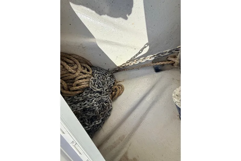 Slide: The Image of Anchor chain and rope in a 2011 Protector Tauranga 38 boat compartment. - 23
