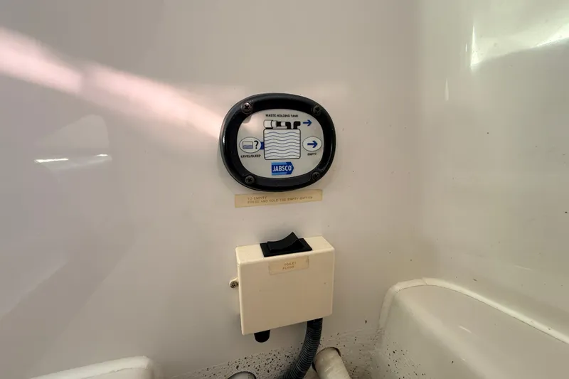 Slide: The Image of Control panel for waste holding tank on 2011 Protector Tauranga 38 boat. - 47