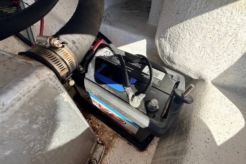 Slide: The Image of Battery compartment of a 2011 Protector Tauranga 38 boat, showing wiring and connections. - 53