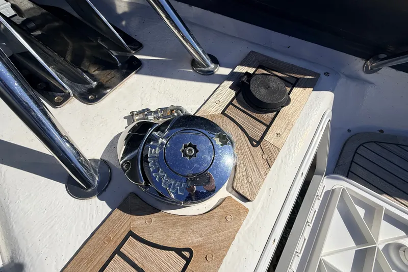 Slide: The Image of Deck of 2011 Protector Tauranga 38 boat with winch and wooden accents. - 24