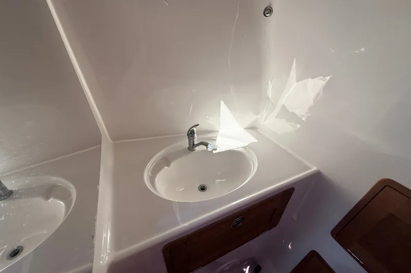 Slide: The Image of Compact bathroom sink in 2011 Protector Tauranga 38 boat interior. - 43