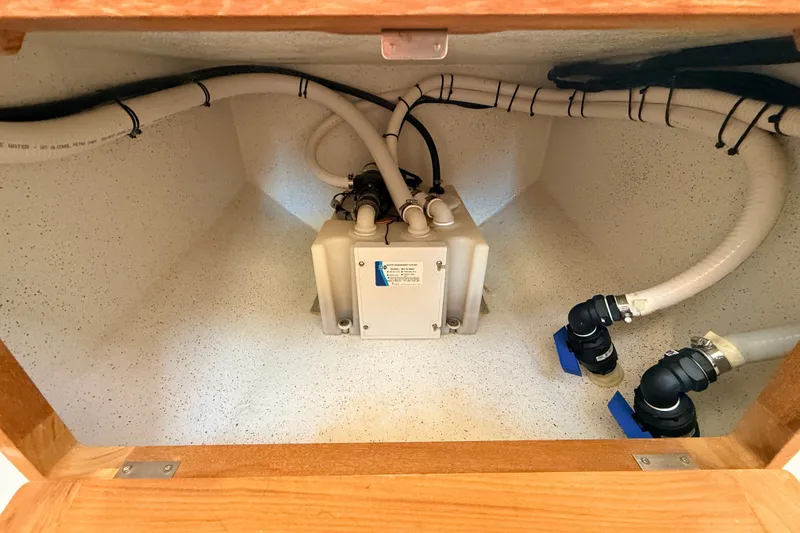 Slide: The Image of 2011 Protector Tauranga 38 interior showing plumbing and electrical components. - 46