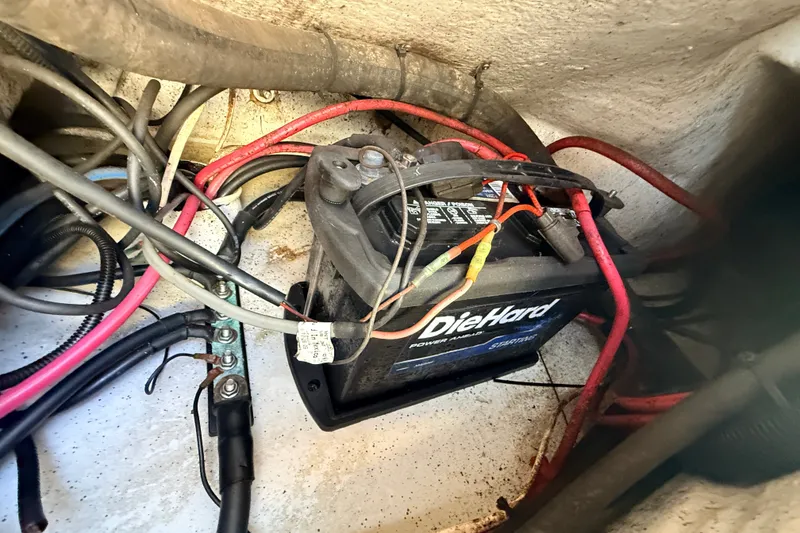 Slide: The Image of Battery compartment of 2011 Protector Tauranga 38 with DieHard battery and wiring. - 52