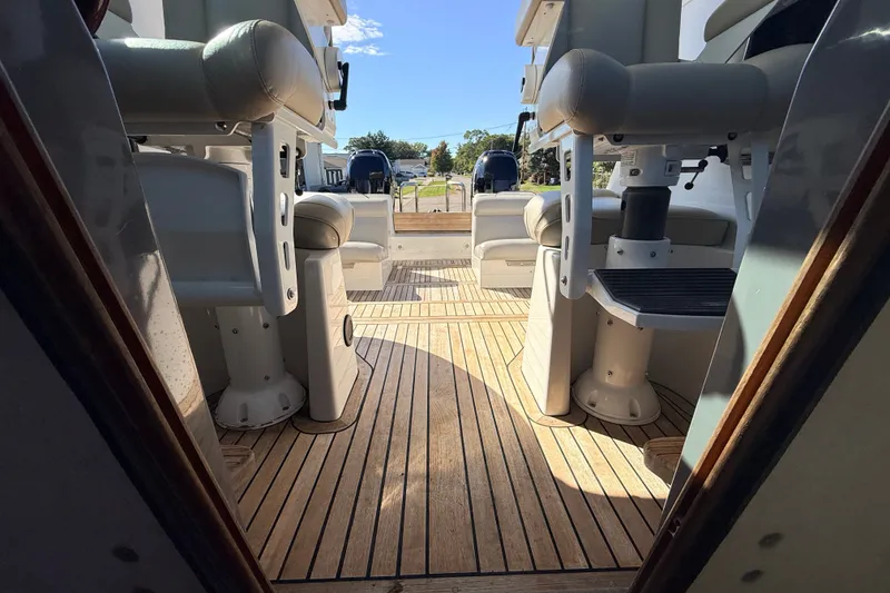 Slide: The Image of Interior view of 2011 Protector Tauranga 38 boat with wooden deck and seating. - 36