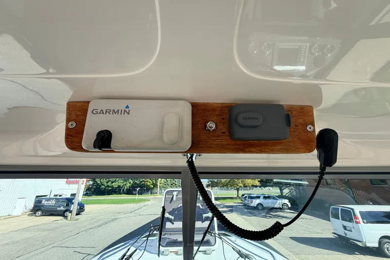 Slide: The Image of Garmin devices mounted on a 2011 Protector Tauranga 38 boat dashboard. - 31