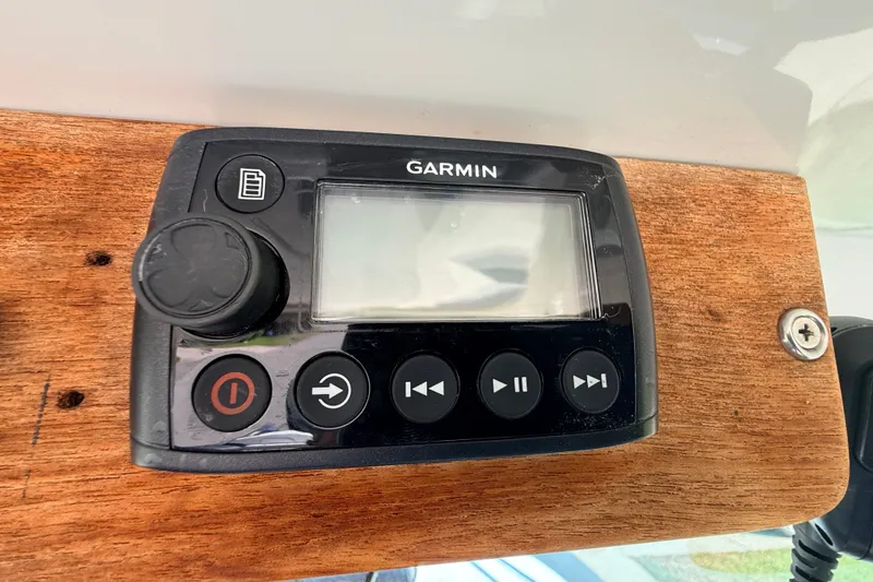 Slide: The Image of Garmin marine device on Protector Tauranga 38 boat, 2011 model, mounted on wooden panel. - 33