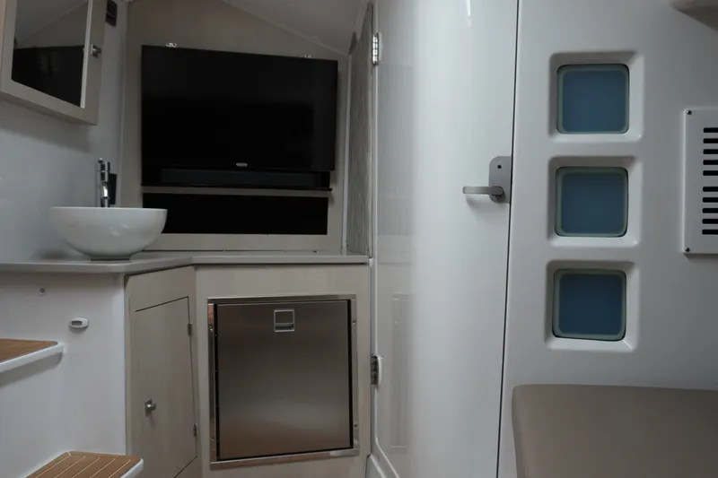 Slide: The Image of Interior of 2027 Monterey Elite 34 OB boat with modern amenities and sleek design. - 31