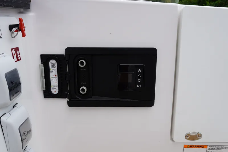 Slide: The Image of Control panel on a 2027 Monterey Elite 34 OB boat, featuring SmartPlug and safety indicators. - 13