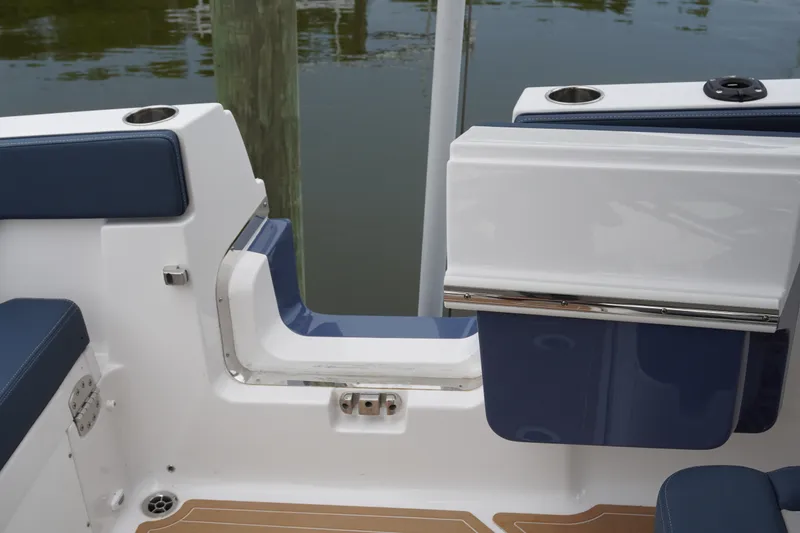 Slide: The Image of 2027 Monterey Elite 34 OB boat interior with blue seating and cup holders. - 16