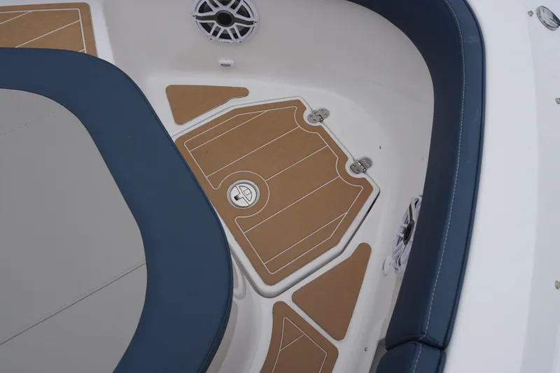 Slide: The Image of 2027 Monterey Elite 34 OB boat interior with cushioned seating and speaker. - 34
