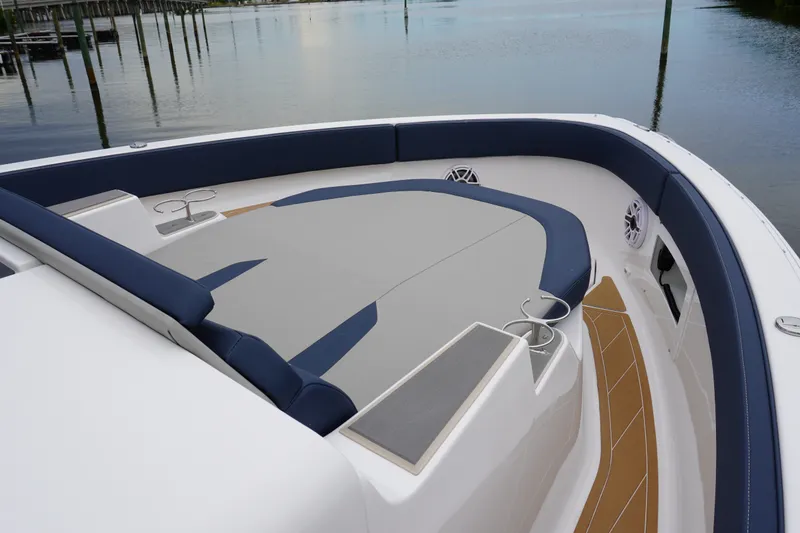 Slide: The Image of 2027 Monterey Elite 34 OB boat interior with sleek seating and modern design. - 27