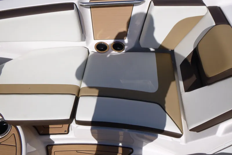 Slide: The Image of 2023 Yamaha Boats 222SD interior seating with beige and white upholstery. - 8