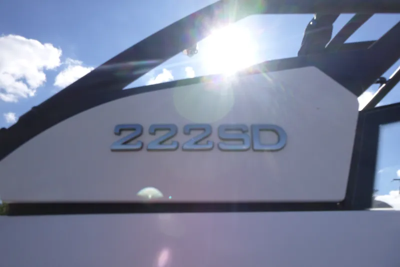 Slide: The Image of 2023 Yamaha Boats 222SD model with sunlight and blue sky background. - 14