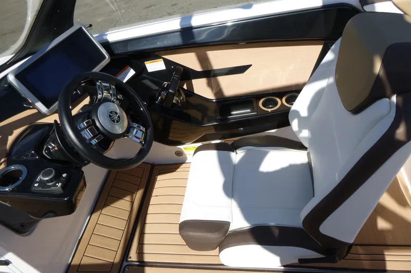 Slide: The Image of 2023 Yamaha Boats 222SD cockpit with steering wheel and modern controls. - 9