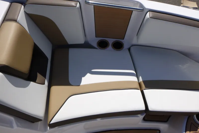 Slide: The Image of 2023 Yamaha Boats 222SD interior seating with brown and white upholstery. - 7