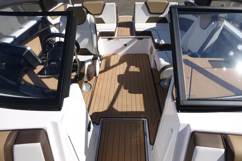 Slide: The Image of 2023 Yamaha Boats 222SD interior with sleek seating and modern dashboard design. - 5