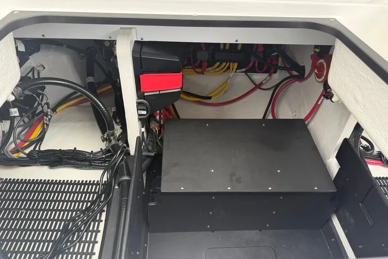 Slide: The Image of Engine compartment of a 2027 Monterey Elite 30 OB boat, showcasing wiring and components. - 25