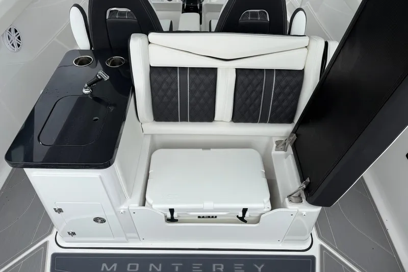 Slide: The Image of Luxury seating and kitchenette area on 2027 Monterey Elite 30 OB boat. - 19