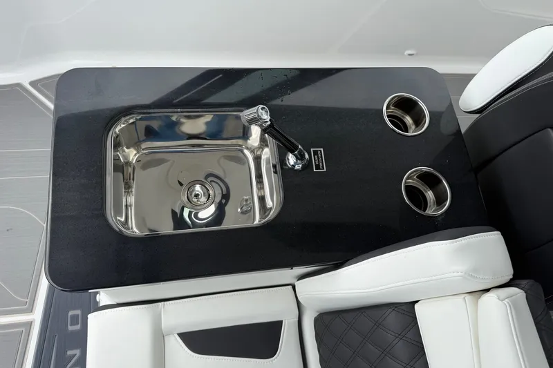 Slide: The Image of Luxurious sink and cup holders on 2027 Monterey Elite 30 OB boat interior. - 20