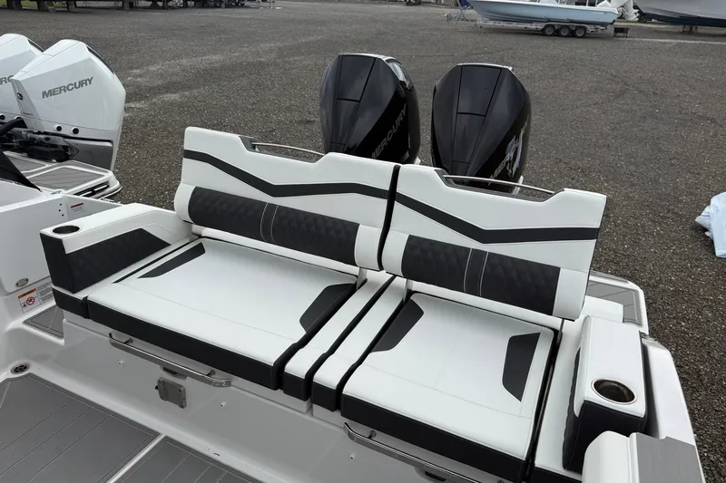 Slide: The Image of 2027 Monterey Elite 30 OB boat with stylish seating and dual Mercury outboard engines. - 21