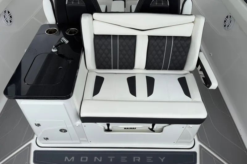 Slide: The Image of Luxury seating and console on 2027 Monterey Elite 30 OB boat, featuring sleek design and modern amenities. - 18