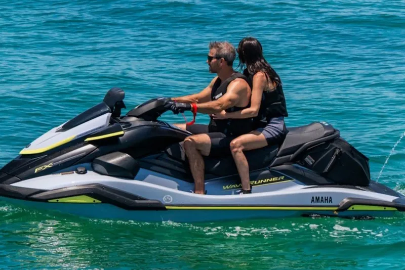 Slide: The Image of Couple riding 2027 Yamaha WaveRunner FX SVHO on clear blue water. - 4