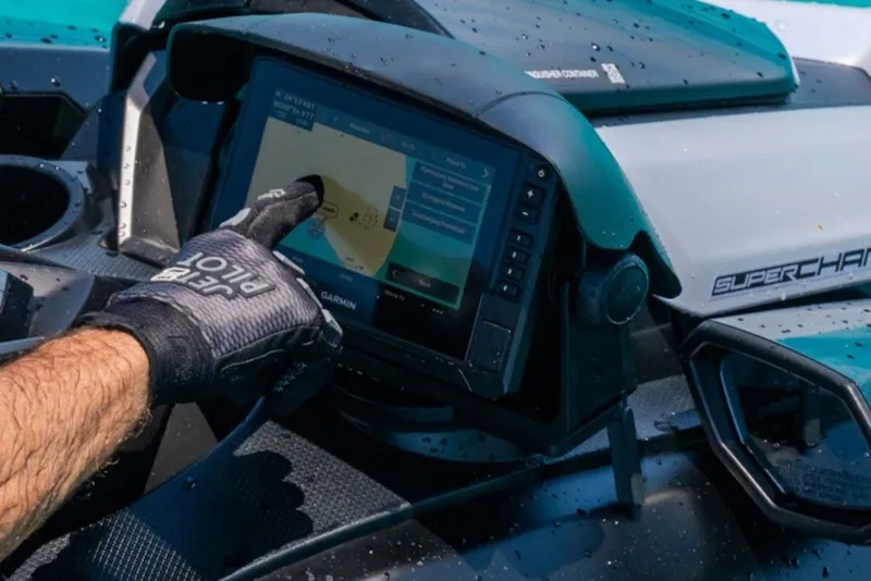 Slide: The Image of Gloved hand using touchscreen on 2027 Yamaha WaveRunner FX SVHO dashboard. - 5