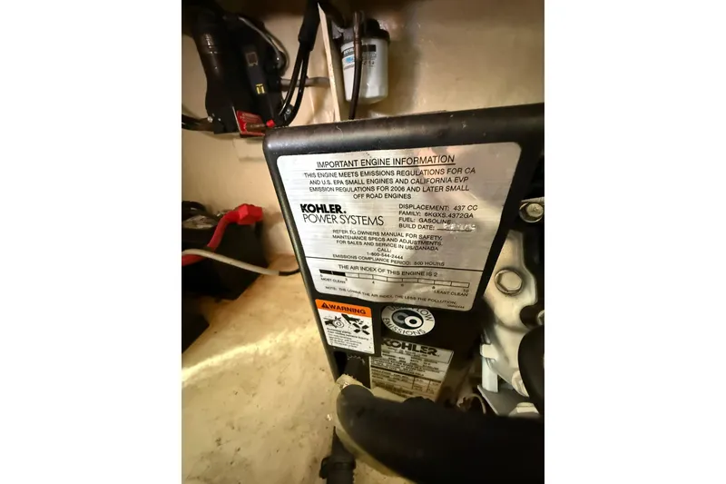 Slide: The Image of Engine compartment of 2009 Sea Ray 350 Sundancer with Kohler power system label. - 43