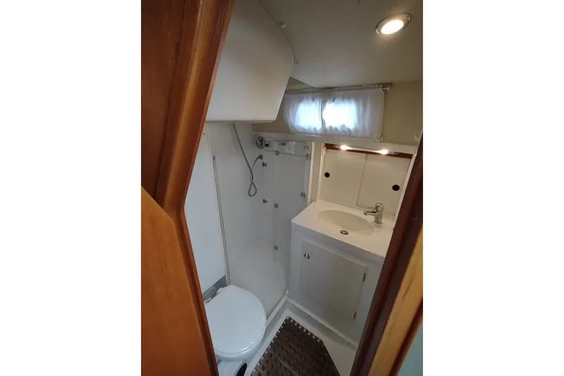 Slide: The Image of Compact bathroom in 2005 Hallberg-Rassy 43 yacht with shower, sink, and toilet. - 57